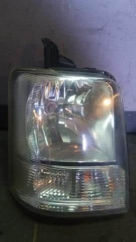Used]Left Headlight SUZUKI Every 2009 EBD-DA64V - BE FORWARD Auto 