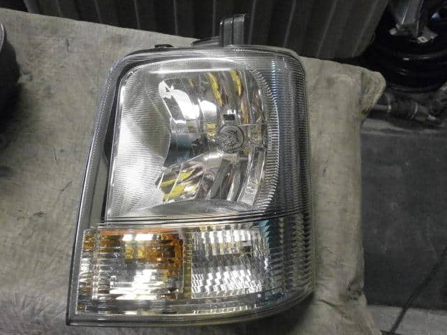 Used]Left Headlight SUZUKI Every EBD-DA64V - BE FORWARD Auto Parts