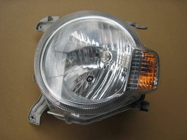 Used]Mira Cocoa L675S Left Headlight 15387689 - BE FORWARD Auto Parts
