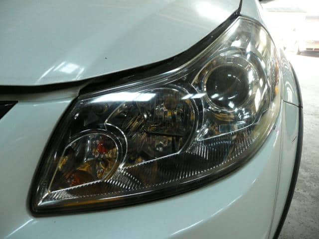 Used]SX4 YA11S Left Headlight 10059104 - BE FORWARD Auto Parts