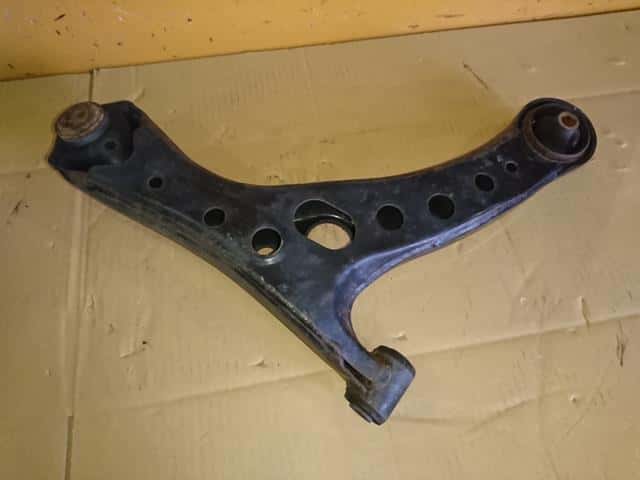 [Used]Voxy ZRR75W Left Front Lower Arm 4806929265 - BE FORWARD Auto Parts