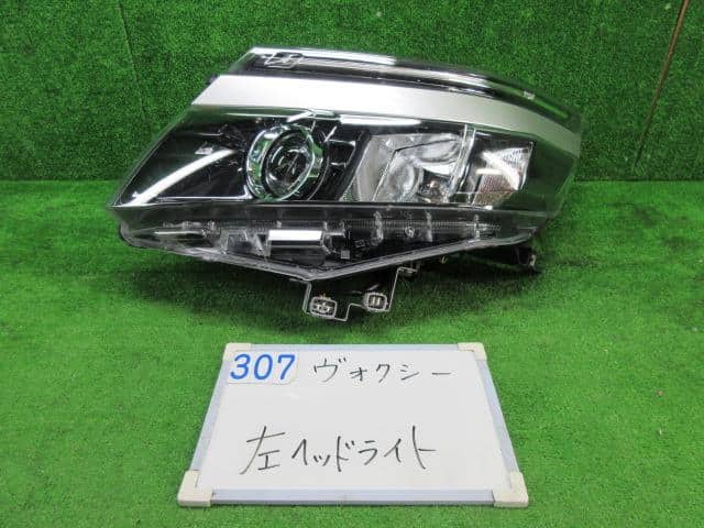 Used]Voxy ZWR80G Left Headlight 8117028D00 - BE FORWARD Auto