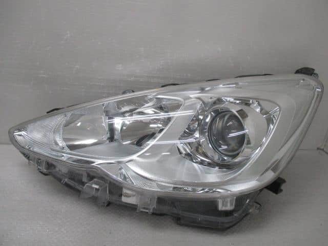 Used]Aqua NHP10 Left Headlight 8115052K40 - BE FORWARD Auto Parts