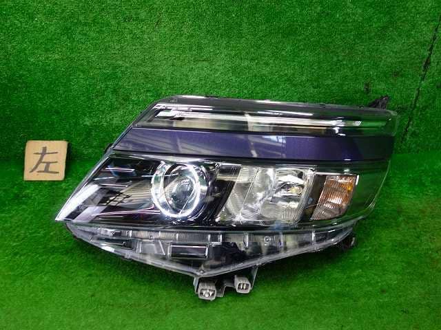 Used]Voxy ZRR80G Left Headlight 8117028D00 - BE FORWARD Auto Parts