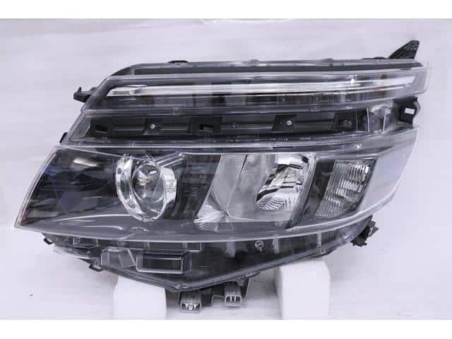 Used]Voxy ZRR80G Left Headlight 8117028D01 - BE FORWARD Auto