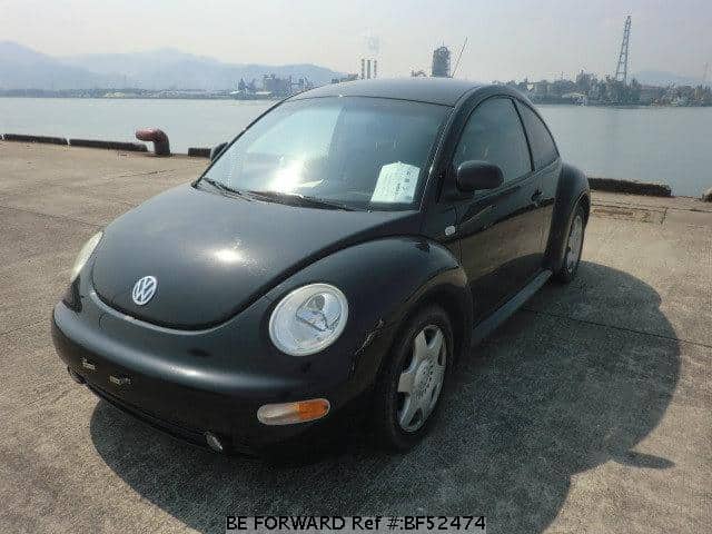 VOLKSWAGEN NEW BEETLE ( COCCINELLE ) berline 1999 noir 1/18 SOLIDO