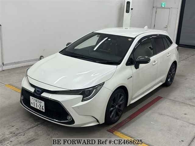 Toyota COROLLA TOURING HYBRID WXB — фото 1